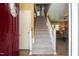 Inviting entryway featuring a staircase and a view into the living room at 205 Cedar Dr, Zebulon, NC 27597