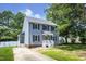 Charming two-story house with a well-maintained lawn and a driveway at 205 Cedar Dr, Zebulon, NC 27597