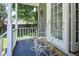 Charming front porch with decorative chairs, perfect for relaxing and enjoying the outdoors at 205 Cedar Dr, Zebulon, NC 27597