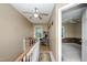 Bright hallway with ceiling fan, connecting to another room at 205 Cedar Dr, Zebulon, NC 27597