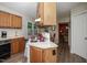 Functional kitchen featuring ample cabinet space, a clean stovetop, and convenient layout at 205 Cedar Dr, Zebulon, NC 27597