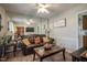 A cozy living room with wood floors and a large mirror at 205 Cedar Dr, Zebulon, NC 27597