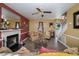 Inviting living room featuring a cozy fireplace, stylish furnishings, and bright, airy ambiance at 205 Cedar Dr, Zebulon, NC 27597