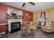 Comfortable living room featuring a fireplace, and neutral colored walls at 205 Cedar Dr, Zebulon, NC 27597