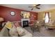 Inviting living room featuring a cozy fireplace, stylish furnishings, and bright, airy ambiance at 205 Cedar Dr, Zebulon, NC 27597