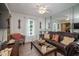 A cozy living room with wood floors and a large mirror at 205 Cedar Dr, Zebulon, NC 27597