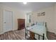 Bedroom features a single bed, wood floors, natural light, and dark wood accents at 206 Vandercroft Way, Bunnlevel, NC 28323