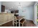 Cozy dining area with hardwood floors, and table with bench seating at 206 Vandercroft Way, Bunnlevel, NC 28323
