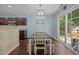 Inviting dining area with table, chairs, and sliding glass doors to the backyard at 206 Vandercroft Way, Bunnlevel, NC 28323