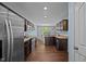 Open kitchen layout with stainless steel appliances and modern fixtures at 206 Vandercroft Way, Bunnlevel, NC 28323