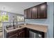 Functional kitchen with stainless steel appliances and dark wood cabinetry at 206 Vandercroft Way, Bunnlevel, NC 28323