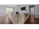 Comfortable sectional couch in living room with hardwood floors, TV, and fireplace at 206 Vandercroft Way, Bunnlevel, NC 28323