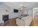 Cozy living room features a fireplace, ceiling fan, and comfortable seating for relaxing at 206 Vandercroft Way, Bunnlevel, NC 28323