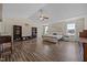 This large main bedroom boasts wood floors, bookshelves, and natural light at 206 Vandercroft Way, Bunnlevel, NC 28323