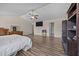 Spacious primary bedroom with wood floors, ceiling fan, and ensuite bathroom access at 206 Vandercroft Way, Bunnlevel, NC 28323