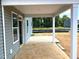 Covered back porch providing an outdoor living and relaxing at 21 Windflower Ct # Homesite 11, Clayton, NC 27520