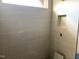 Modern bathroom features tiled walls and a convenient inset shelf at 21 Windflower Ct # Homesite 11, Clayton, NC 27520