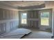 Primary bedroom showcasing tray ceiling and dual windows, great natural light at 21 Windflower Ct # Homesite 11, Clayton, NC 27520