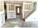 The entryway with stairs to the second floor is bright with natural light, enhanced by its fresh palette at 21 Windflower Ct # Homesite 11, Clayton, NC 27520