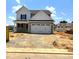 This lovely new home features a spacious two-car garage and a professionally landscaped front yard at 21 Windflower Ct # Homesite 11, Clayton, NC 27520