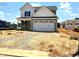 New home features a spacious two-car garage, complemented by a professionally landscaped front yard at 21 Windflower Ct # Homesite 11, Clayton, NC 27520