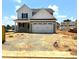 Charming two-story home with a two-car garage and well-manicured lawn on a sunny day at 21 Windflower Ct # Homesite 11, Clayton, NC 27520