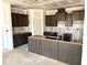Modern kitchen features stylish cabinets and a central island, perfect for culinary enthusiasts and gatherings at 21 Windflower Ct # Homesite 11, Clayton, NC 27520