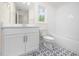 Bathroom with a single vanity, a patterned tile floor, and a bathtub and shower combination at 225 Whistlers Cv, Louisburg, NC 27549