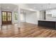 Spacious living and dining area with wood floors, natural light, and easy access to the kitchen, perfect for entertaining at 225 Whistlers Cv, Louisburg, NC 27549