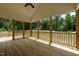 This screened-in back porch offers a perfect retreat with views of the lush, surrounding greenery at 225 Whistlers Cv, Louisburg, NC 27549