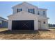 Two-story home showcasing unfinished garage, new construction, and great potential for personalization at 236 Norman Ave, Lillington, NC 27546