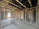 Spacious interior under construction showcases wood framing for walls and ceiling at 236 Norman Ave, Lillington, NC 27546