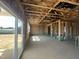 Spacious, unfinished interior with sliding glass door, ready to be transformed into a dream living space at 236 Norman Ave, Lillington, NC 27546