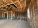 Unfinished home interior with exposed framing, offering a glimpse into the construction progress at 236 Norman Ave, Lillington, NC 27546
