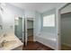 Primary bath with double vanity, walk in closet and separate bathtub at 2430 Josephine Rd, Garner, NC 27529
