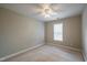 Neutral bedroom with a ceiling fan and window, offering a comfortable space at 2430 Josephine Rd, Garner, NC 27529
