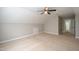 Large bonus room with a ceiling fan, a closet, and an open door into another room at 2430 Josephine Rd, Garner, NC 27529