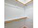 Spacious walk-in closet with wooden rods and shelving offers ample storage space at 2430 Josephine Rd, Garner, NC 27529