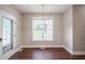 Dining room with hardwood floors, neutral walls, and access to the backyard at 2430 Josephine Rd, Garner, NC 27529