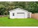 Exterior of a detached garage with a single door and a side door, offering ample storage and parking space at 2430 Josephine Rd, Garner, NC 27529
