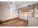 Spacious garage features ample room for parking and storage, and a garage door that is partially open at 2430 Josephine Rd, Garner, NC 27529