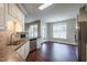 Open kitchen includes stainless dishwasher, granite counters and breakfast nook at 2430 Josephine Rd, Garner, NC 27529