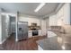 Modern kitchen with stainless steel appliances, granite countertops, and ample cabinet space at 2430 Josephine Rd, Garner, NC 27529