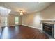 Bright living room featuring hardwood floors, a fireplace, and ample natural light at 2430 Josephine Rd, Garner, NC 27529