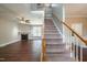 Cozy living room with hardwood floors, fireplace, and staircase to the second floor at 2430 Josephine Rd, Garner, NC 27529