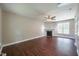Open-concept living room with hardwood floors, a fireplace, and a ceiling fan at 2430 Josephine Rd, Garner, NC 27529