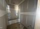 Bathroom with tub-shower combination, raw walls, and plumbing fixtures awaiting completion at 246 Norman Ave, Lillington, NC 27546