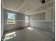 Spacious bedroom featuring two windows and unfinished drywall ready for customization and personal design at 246 Norman Ave, Lillington, NC 27546