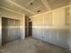 Unfinished bedroom with drywall, ready for customization, and two doorways at 246 Norman Ave, Lillington, NC 27546