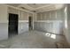 Large bedroom showcasing unfinished drywall with ample natural light from windows, awaiting personalized finishes at 246 Norman Ave, Lillington, NC 27546